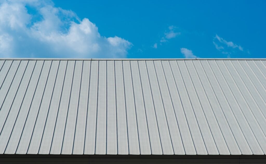 Metal sheet for industrial roof and blue sky.