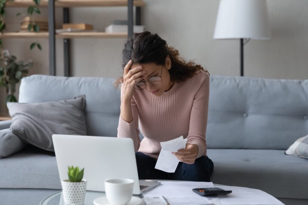 woman worrying over bills