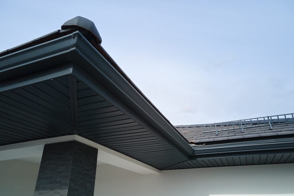dark colored metal gutter system