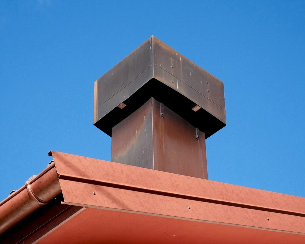 Chimney pot completely covered in copper and cast iron