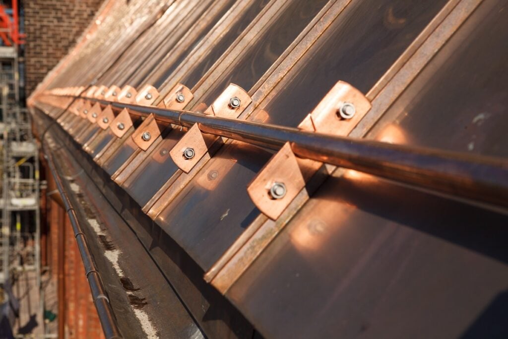 close up of copper roofing secured