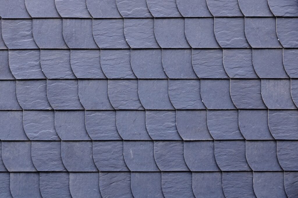 Aged slate roof tiles in close-up