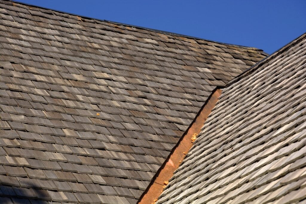 new wood shingle roof with copper gutter