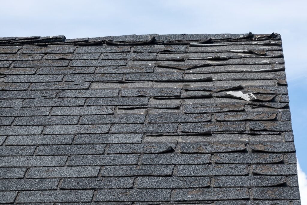 Badly damage roof shingles