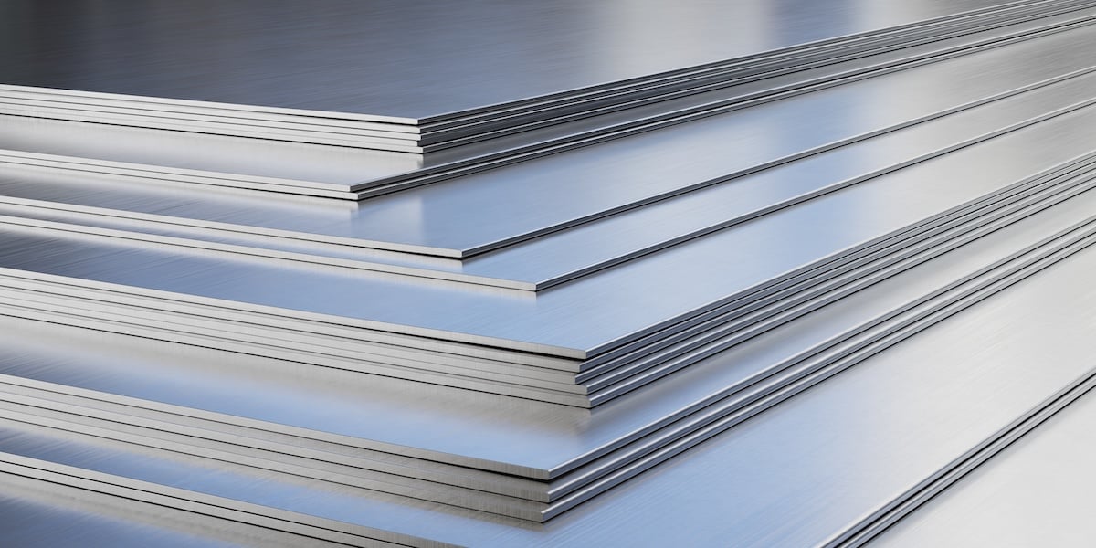 Steel sheets in warehouse, rolled metal product.
