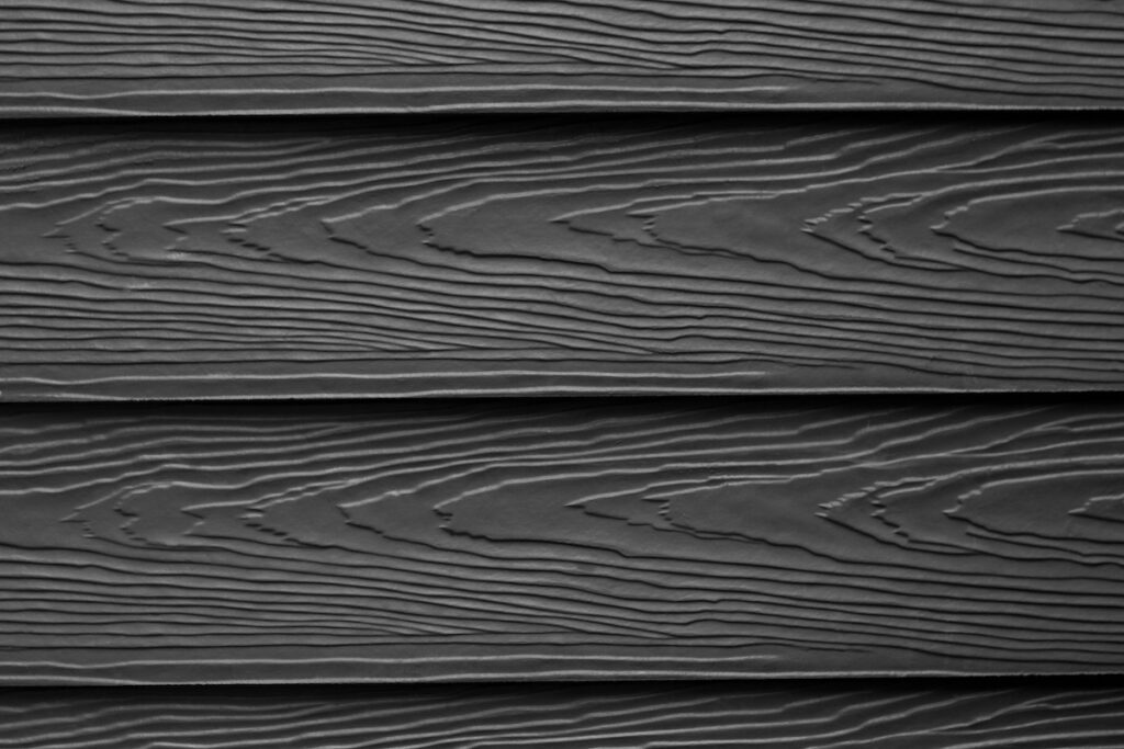 Close up the black substituted wood siding