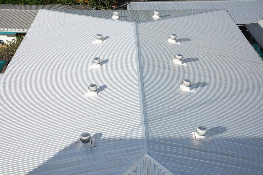 Beautiful gray metal sheet roof in commercial construction.