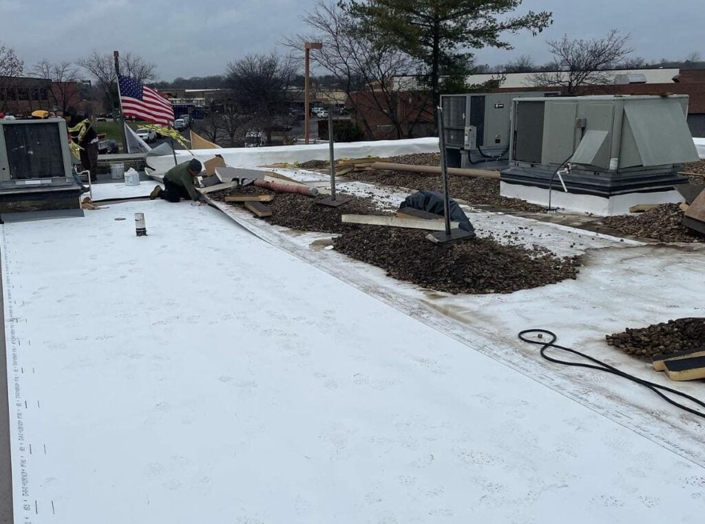 roofer repairing commercial roof