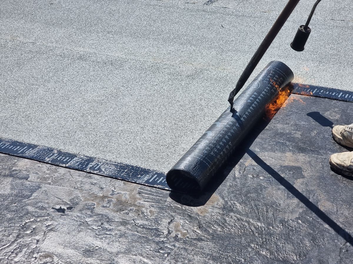 applying waterproofing to a flat roof