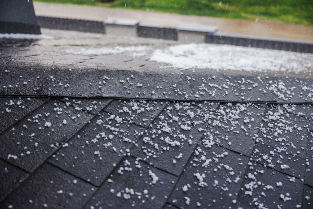 close-up of a shingle roof with hail