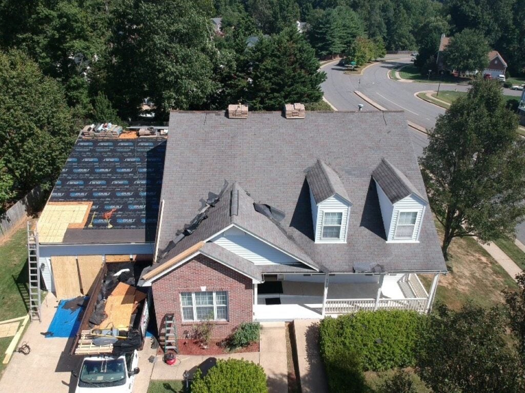 certified roofing contractor Springfield Roofing workers on top of certified roof