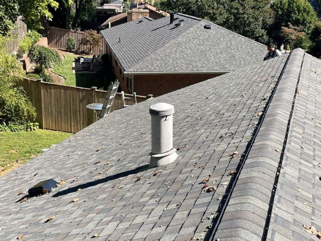 repair or replace roof Springfield Roofing grey shingles roof close up house