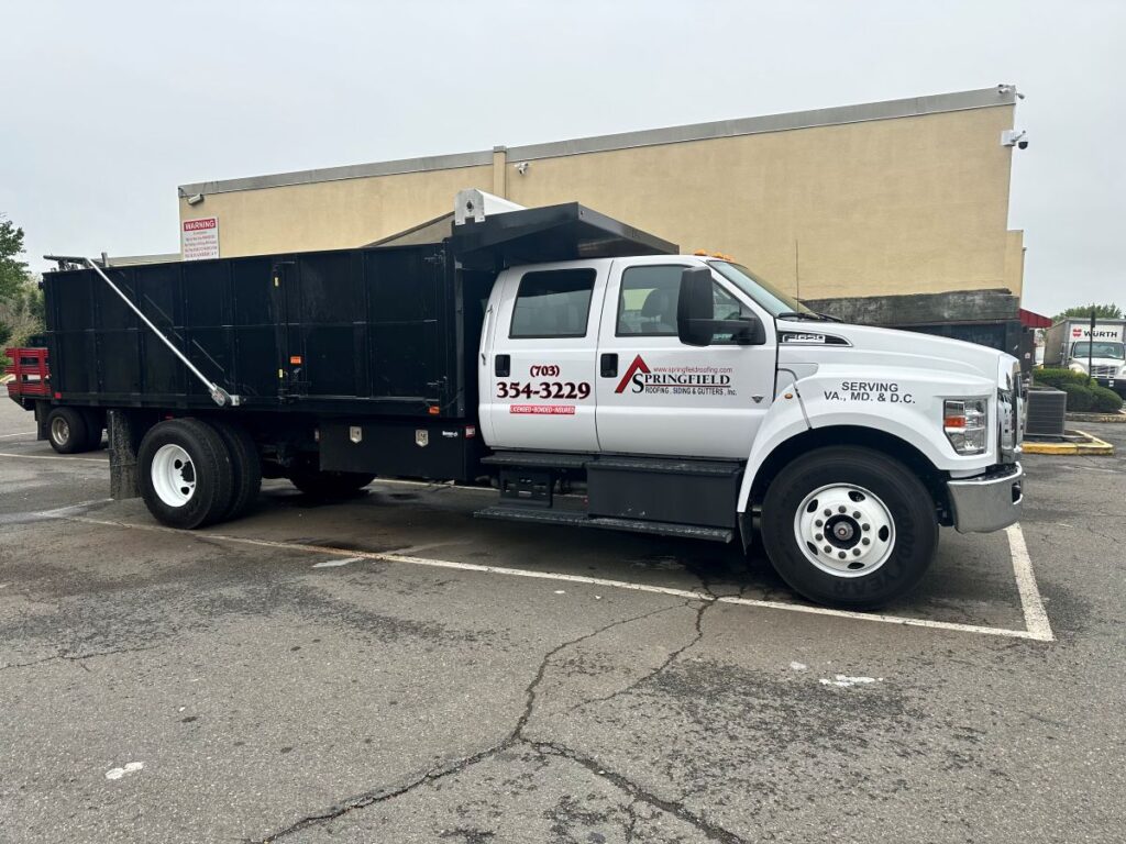 trusted roofing company Springfield Roofing project branded truck on parking lot