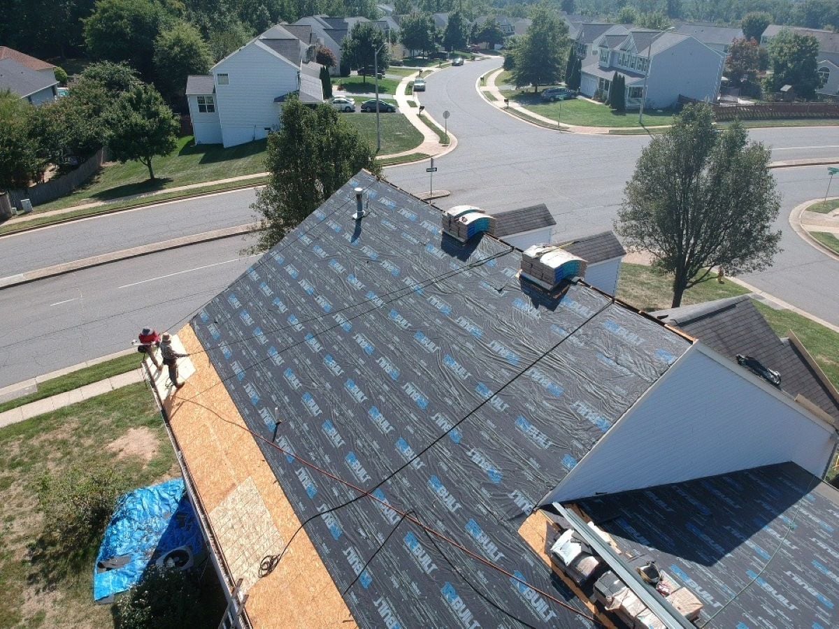 what to expect during roof replacement workers replacing