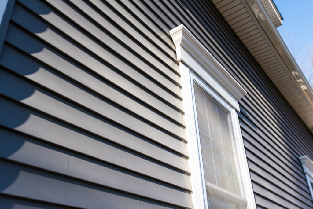 Dark vinyl siding in residential neighborhood