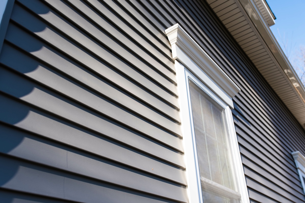 Dark vinyl siding in residential neighborhood