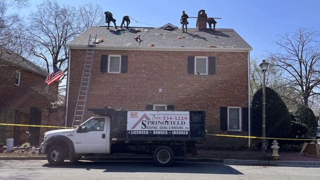 Springfield Roofing team replacing shingles roof