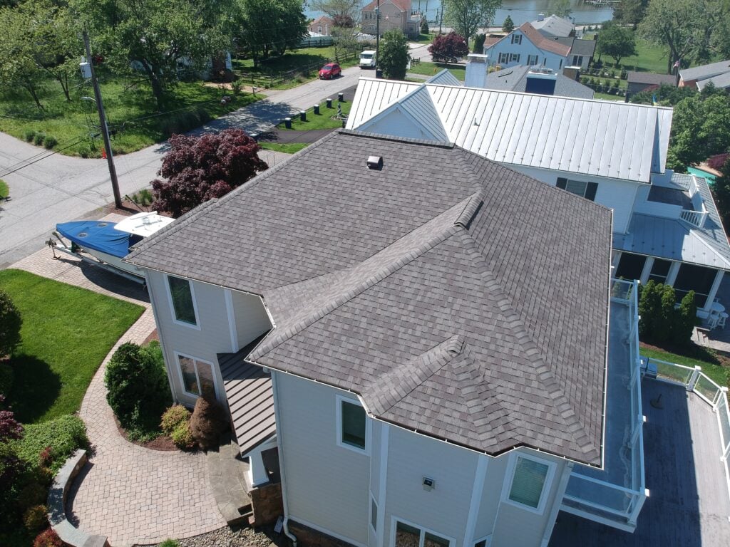 roof replacement process big shingles roof house aerial view