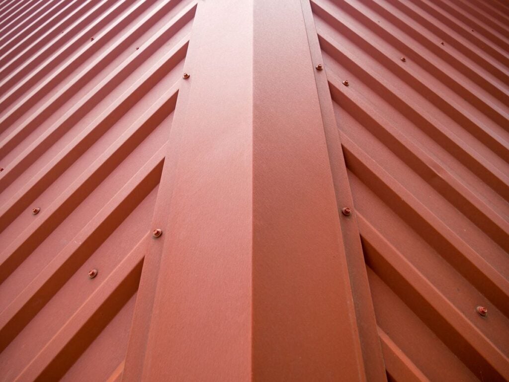 Fragment of the roof of a building covered with a metal