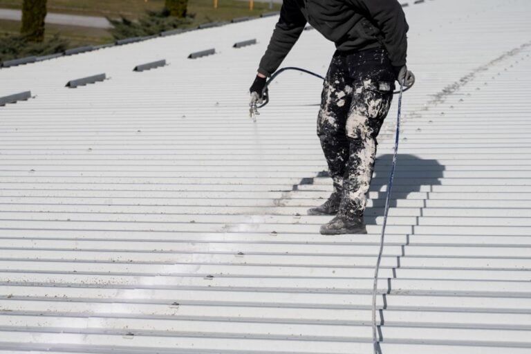 Metal roof painting with compressor