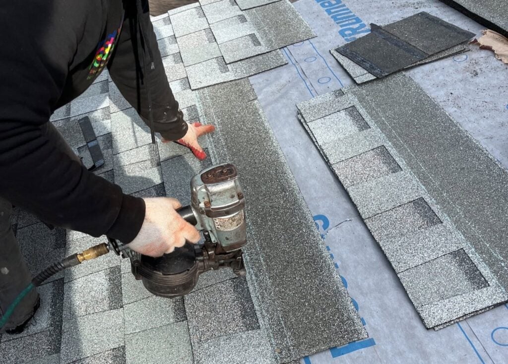 Springfield Roofing team installing new shingles