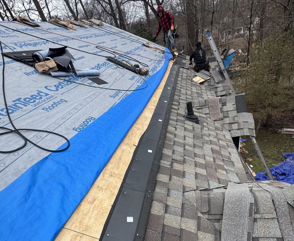 Springfield Roofing team repairing a roof leak
