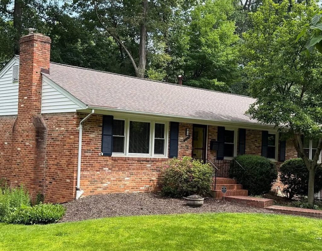 A house with a newly installed shingle roof