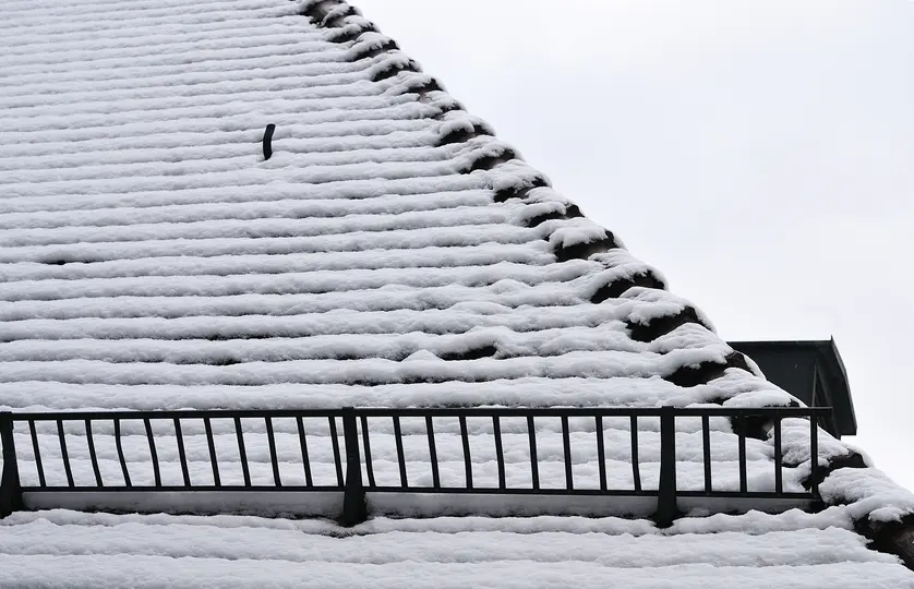 snow guard on a snowy roof